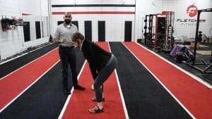 Man avoiding back pain from lifting by using a proper hip hinge
