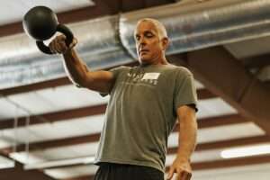 Active older adult doing strength training after 50 to build muscle and bone