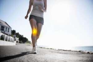 Woman jogging outdoors while working on her running technique