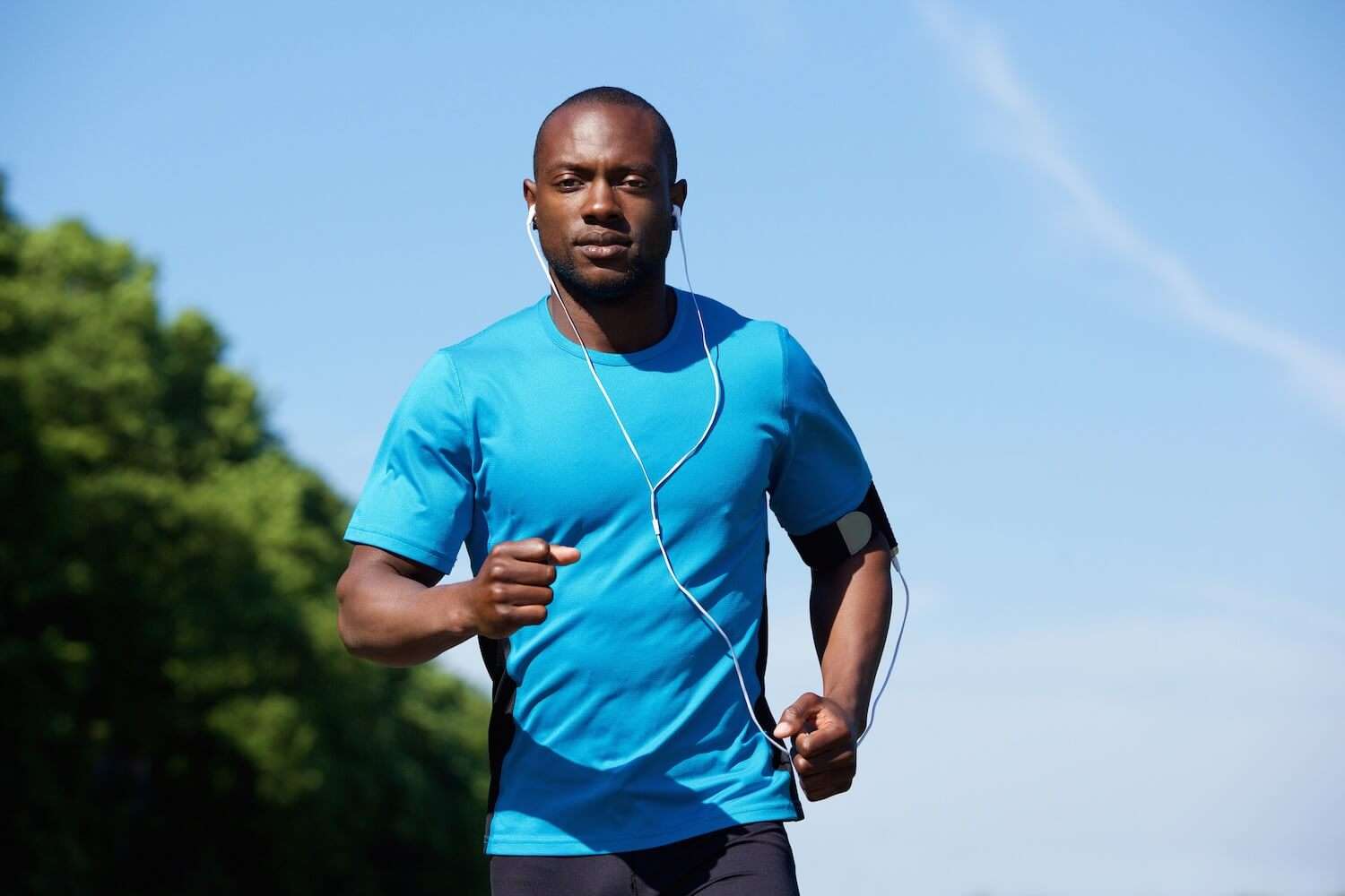 Fit man running outside